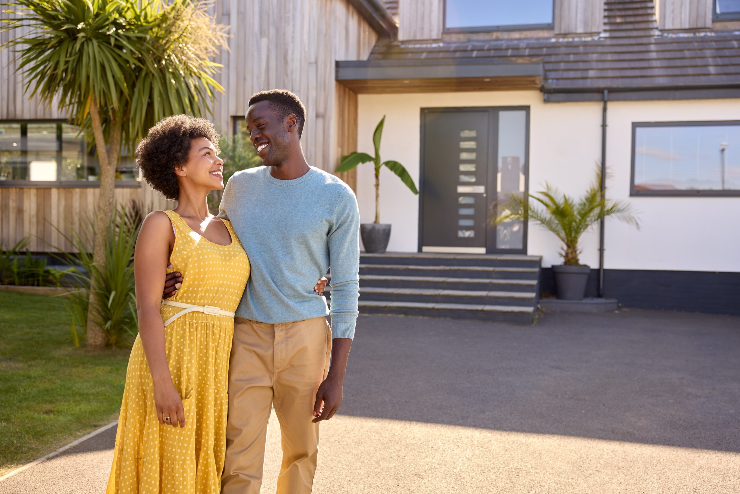 Couple Standing in Driveway